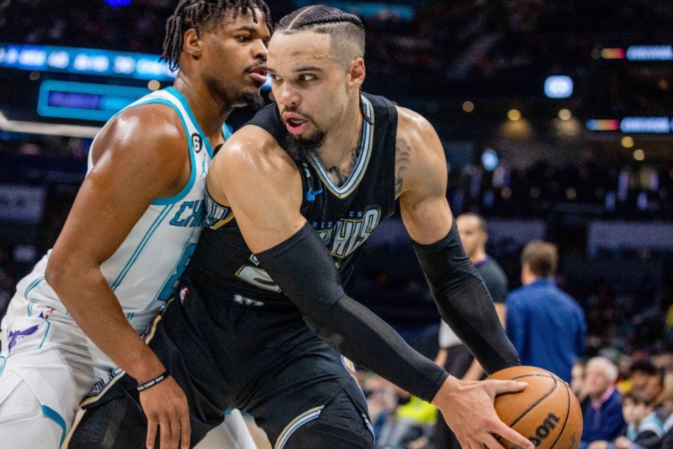 <strong>Charlotte Hornets guard Dennis Smith Jr. leans on Memphis Grizzlies forward Dillon Brooks during the first half of an NBA basketball game on Wednesday, Jan. 4, 2023, in Charlotte, N.C.</strong> (AP Photo/Scott Kinser)