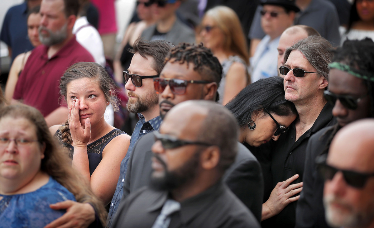 <strong>Tiffany Canerday (left) and Sandy Ellison (right) react as the casket of Memphis musician Omar Higgins is carried into Clayborn Temple for a visitation and funeral service on Tuesday, April 30, 1019.</strong> (Jim Weber/Daily Memphian)