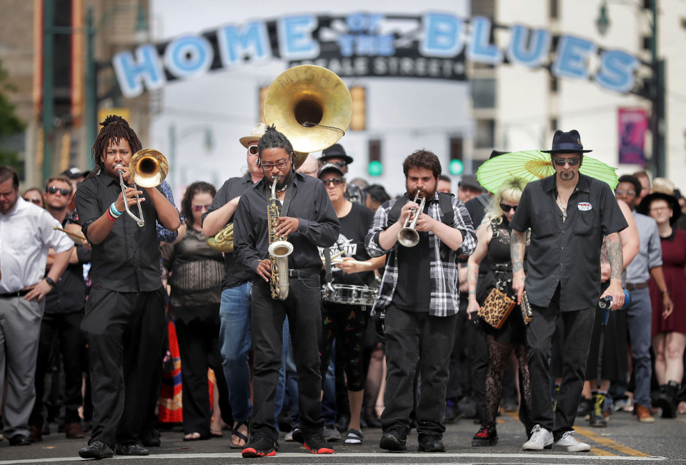 <strong>Local musicians, fans, friends and family gather for a Beale Street funeral procession to honor musician Omar Higgins, who was leader of the reggae band Chinese Connection Dub Embassy and hardcore punk band Negro Terror. A crowd led Higgins' casket on April 30, 2019, ion the second line style to Clayborn Temple for a visitation and funeral service.</strong> (Jim Weber/Daily Memphian)