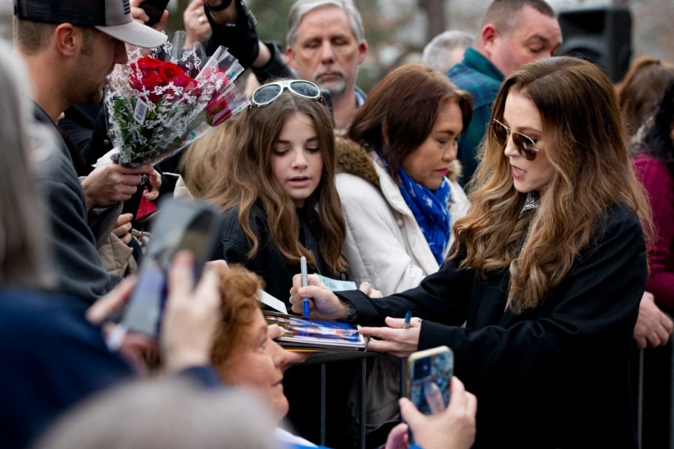 <strong>Lisa Marie Presley (right) and fans of her late father, Elvis Presley, celebrate his birthday at Graceland on Sunday, Jan. 8.</strong> (Ziggy Tucker/Special to The Daily Memphian)