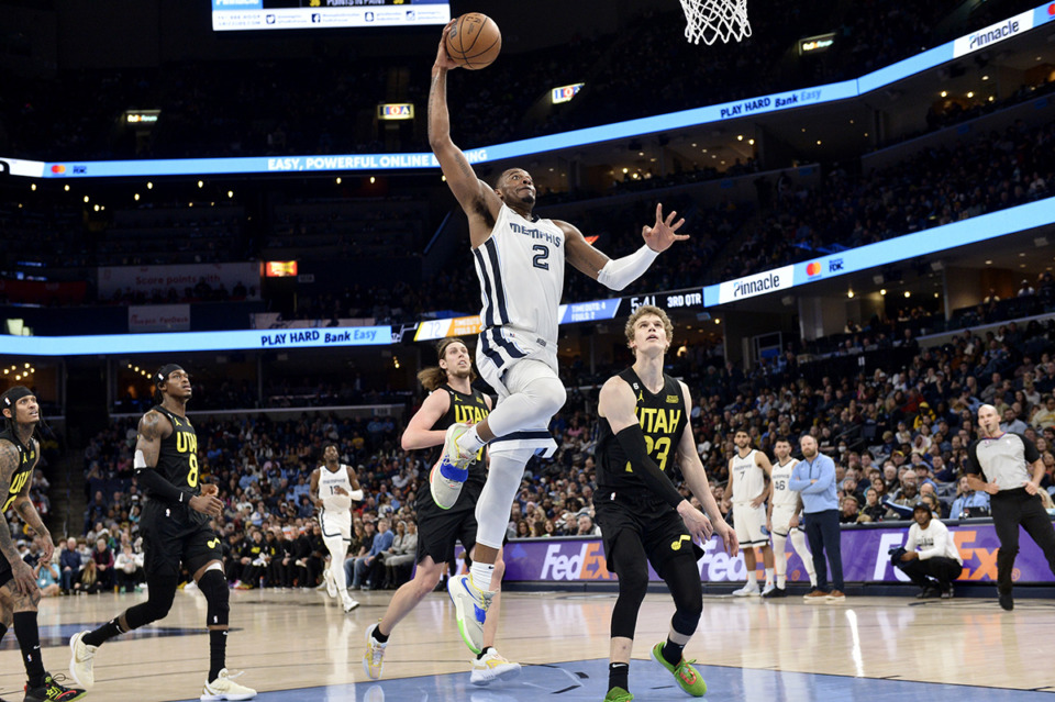 <strong>Memphis Grizzlies forward Xavier Tillman (2) goes up for a dunk ahead of Utah Jazz forward Lauri Markkanen (23) in the game Sunday, Jan. 8 at FedExForum.</strong> (Brandon Dill/AP Photo)