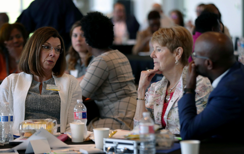 <strong>Kiki Hall (left) discusses the opioid crisis in Tennessee with Judy Vail and Quintin Robinson during a group work session Tuesday, April 30, 2019, part of the first West Tennessee Opioid Summit sponsored by Cigna at the FedEx Event Center at Shelby Farms Park.</strong>&nbsp;(Patrick Lantrip/Daily Memphian)