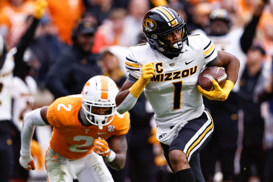 <strong>Missouri wide receiver Tauskie Dove (1) outruns Tennessee defensive back Jaylen McCollough (2) during the first half of an NCAA college football game Saturday, Nov. 12, 2022, in Knoxville, Tenn.</strong> (AP File Photo/Wade Payne)