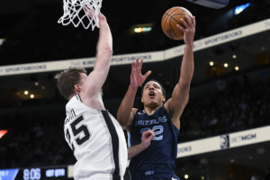 <strong>Memphis Grizzlies guard Desmond Bane (22) shoots against San Antonio Spurs center Jakob Poeltl (25) during the first half of an NBA basketball game Wednesday, Jan. 11, 2023, in Memphis, Tenn.</strong> (Brandon Dill/AP Photo)