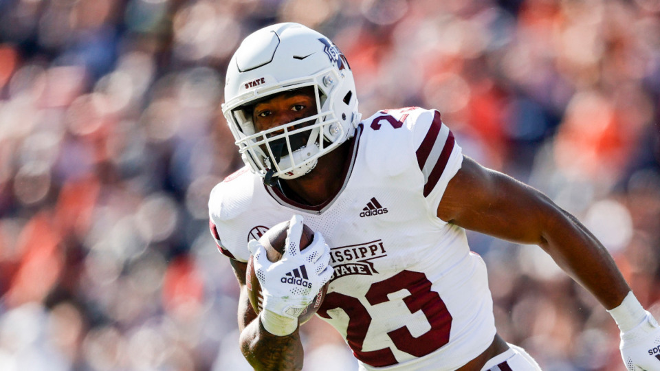 <strong>Mississippi State running back Ketravion Hargrove (21) carries the ball during the second half of an NCAA college football game against Auburn Saturday, Nov. 13, 2021, in Auburn, Ala.</strong> (AP Photo/Butch Dill)