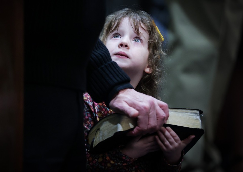 <strong>Presley Cox holds the Bible for her grandfather, Jeff Cox, as he gets sworn in as the new Bartlett Police Chief Jan. 12, 2023.</strong> (Patrick Lantrip/The Daily Memphian)