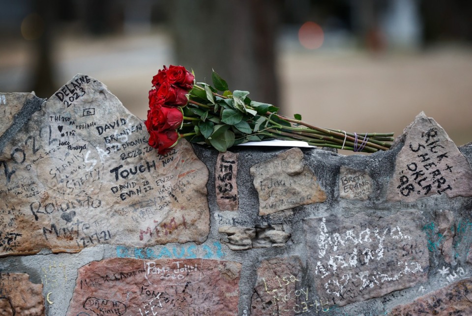 <strong>After the passing of Lisa Marie Presley on Thursday, flowers are left on the wall outside Graceland on Friday, Jan. 13, 2023.</strong> (Mark Weber/The Daily Memphian)