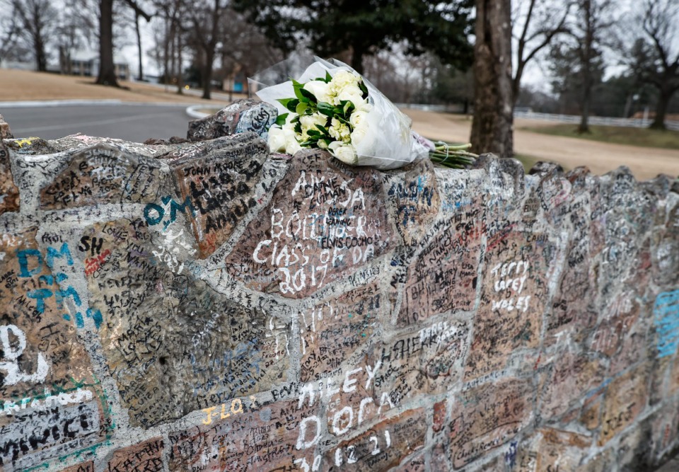 <strong>Floral tributes to Lisa Marie Presley adorn the wall at Graceland on Friday, Jan. 13, 2023.</strong> (Mark Weber/The Daily Memphian)