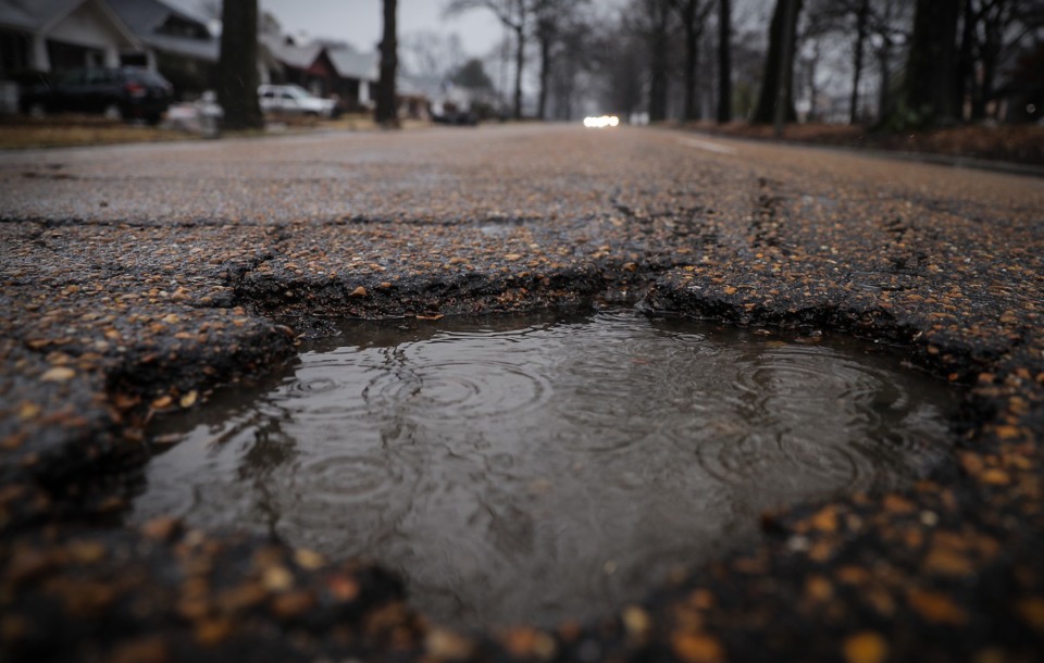 <strong>Water fills a large pothole on North Parkway Jan. 12, 2023.</strong> (Patrick Lantrip/The Daily Memphian)
