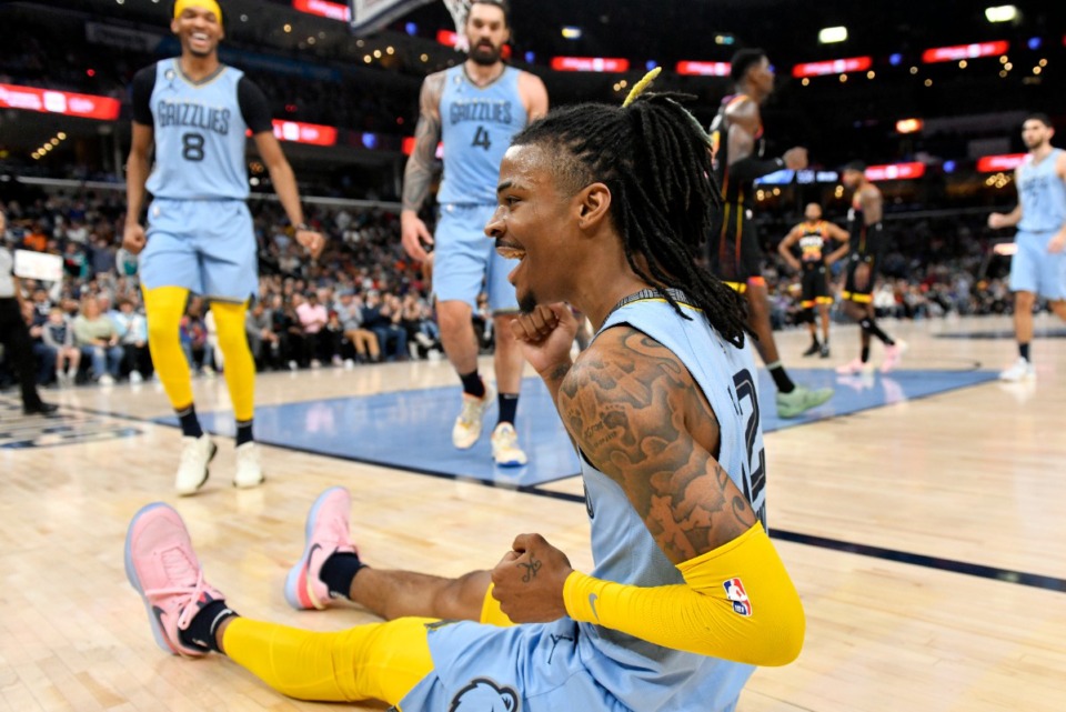 <strong>Memphis Grizzlies guard Ja Morant, foreground, reacts in the second half of an NBA basketball game against the Phoenix Suns, Monday, Jan. 16, 2023, in Memphis.</strong> (AP Photo/Brandon Dill)