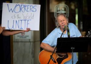 <strong>Paul Crum performs for a small crowd during a May Day Rally outside City Hall on May 1, 2019, to celebrate International Workers' Day promoted by the labor movement to honor workers and draw attention to issues like workplace inequality, the wage gap, parental leave and sexual harassment.</strong> (Jim Weber/Daily Memphian)