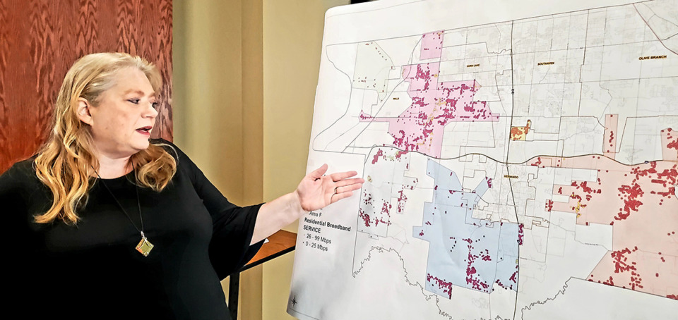 <strong>Christie Barclay, the county&rsquo;s community resource director, conducted an analysis of about 70,000 households in DeSoto County that pinpointed clusters of areas lacking high-speed Internet. She gestures toward one of the clusters outside the Board of Supervisor's meeting room.</strong> (Toni Lepeska/The Daily Memphian)