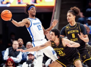 <strong>Tigers forward DeAndre Williams (left) makes a pass around the Wichita State defense on Thursday, Jan. 19, 2023.</strong> (Mark Weber/The Daily Memphian)