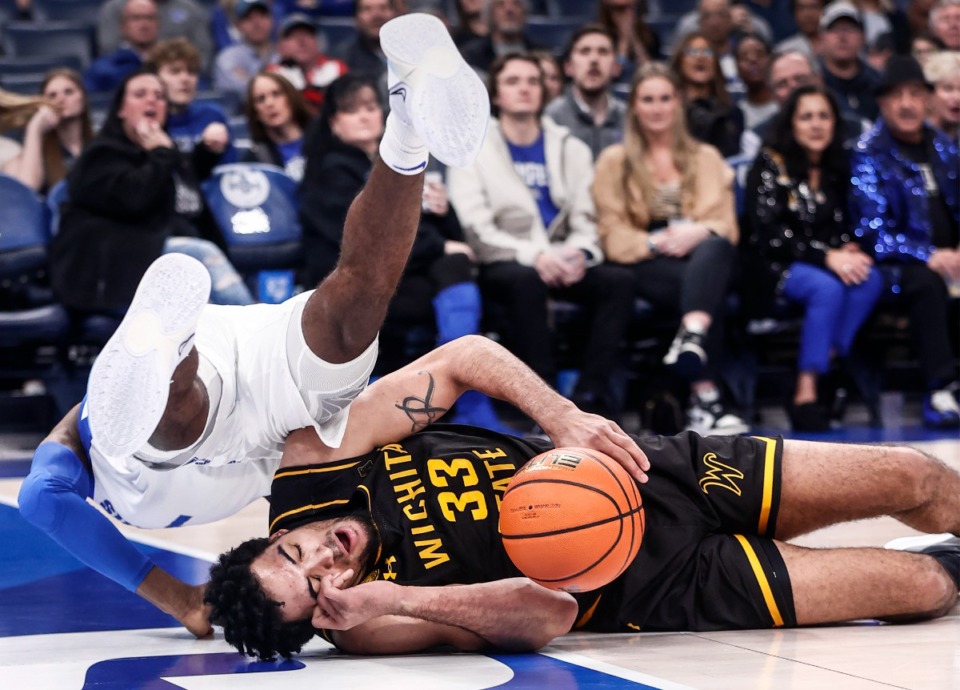 <strong>Tigers defender Keont&eacute; Kennedy (top) battles Wichita State forward James Rojas (right) for a loose ball on Thursday, Jan. 19, 2023.</strong> (Mark Weber/The Daily Memphian)