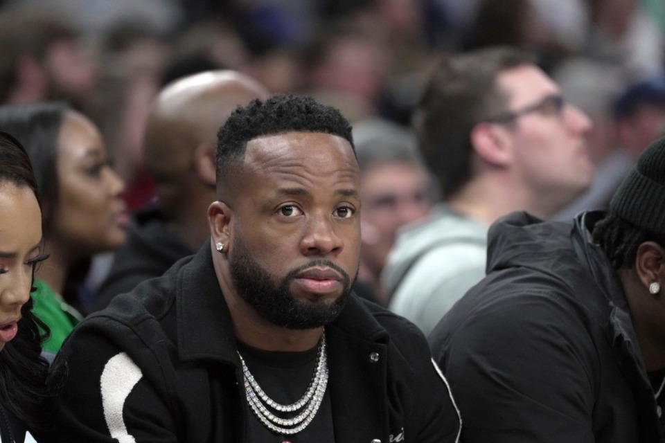 <strong>Yo Gotti sat with Angela Simmons (partially visible, left) at&nbsp;the Memphis Grizzlies game Wednesday, Jan. 18, at FedExForum.</strong> (Karen Pulfer Focht/AP)