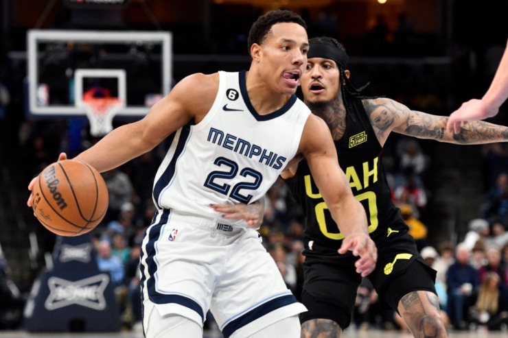 <strong>Memphis Grizzlies guard Desmond Bane (22) handles the ball against Utah Jazz guard Jordan Clarkson at FedExForum Sunday, Jan. 8.</strong> (Brandon Dill/AP)