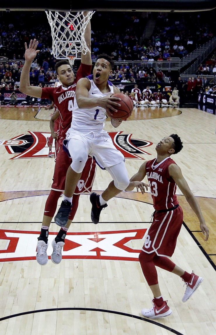 <strong>TCU's Desmond Bane (1) gets past Oklahoma's Jamuni McNeace (4) to put up a shot during the second half of an NCAA college basketball game in the Big 12 Conference tournament Wednesday, March 8, 2017 in Kansas City, Mo. TCU won 82-63.</strong> (Charlie Riedel/AP file)