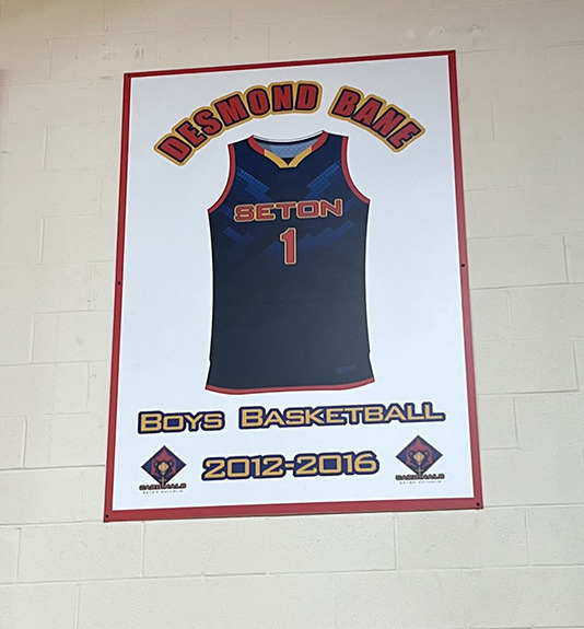 <strong>Desmond Bane&rsquo;s retired Seton Catholic uniform jersey hangs on the wall in the school gym.</strong> (Drew Hill/The Daily Memphian)