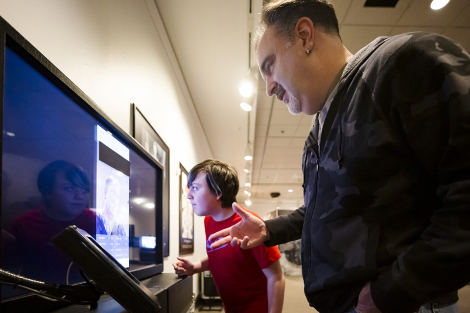 <strong>John Wood (right) and Benjamin Ruiz (left) discover how artificial intelligence learns facial recognition with motion capture at the Museum of Science and History on Jan. 22.</strong> (Ziggy Mack/Special to The Daily Memphian)