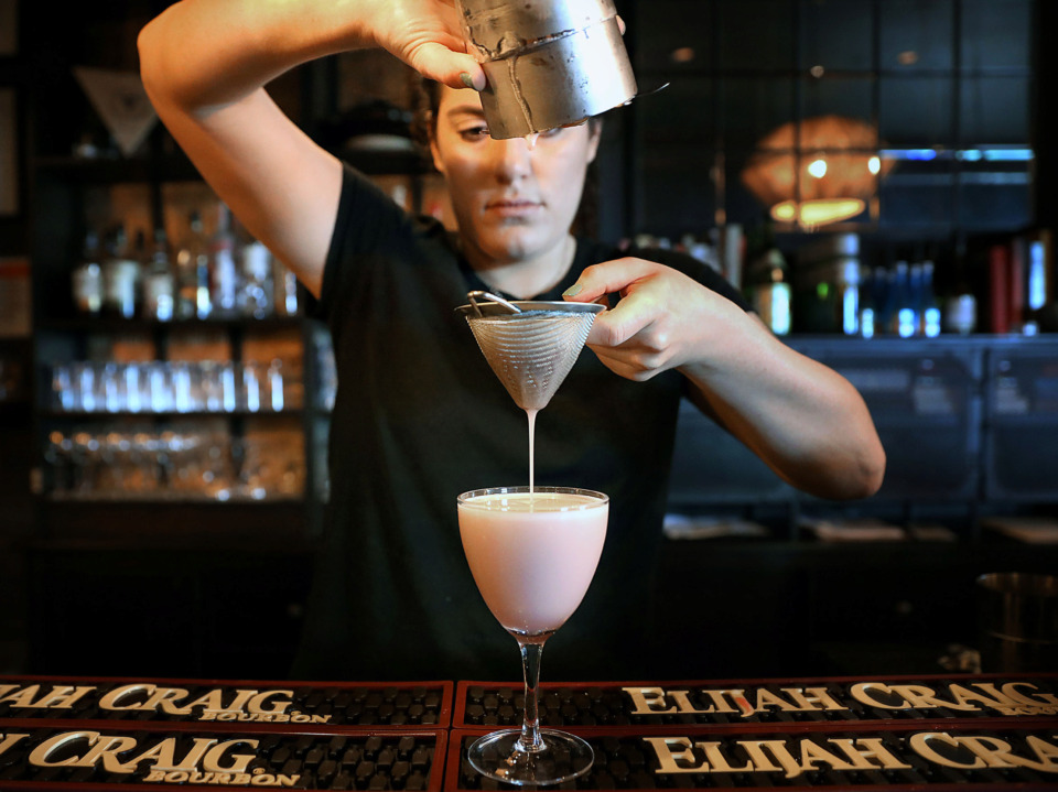 <strong>Lucky Cat offers a number of signature cocktails, such as the Shiso Heavy as made by bartender McKenzie Nelson.</strong> (Patrick Lantrip/Daily Memphian)