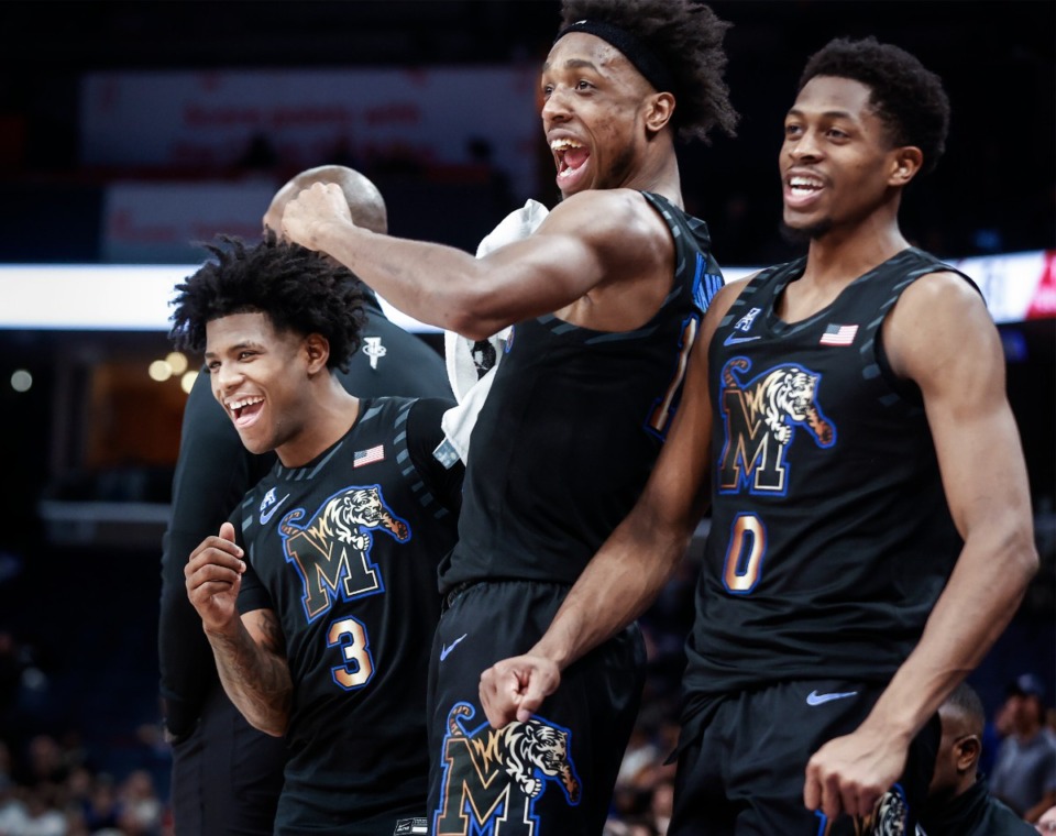 <strong>Tigers (from left) Kendric Davis, DeAndre Williams and Elijah McCadden celebrate on the bench against SMU on Thursday, Jan. 26, 2023.</strong> (Mark Weber/The Daily Memphian)