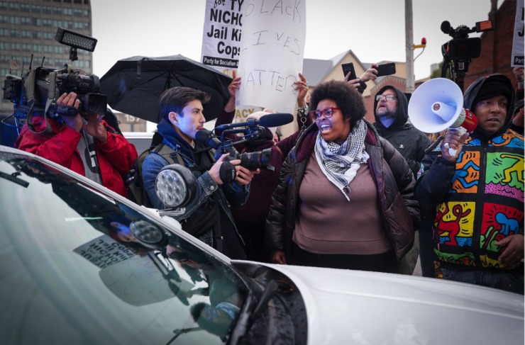 <strong>Activists momentarily surround an MPD cruiser outside of 201 Poplar before moving on while marching throughout downtown Memphis Jan. 28, 2023.</strong> (Patrick Lantrip/The Daily Memphian)