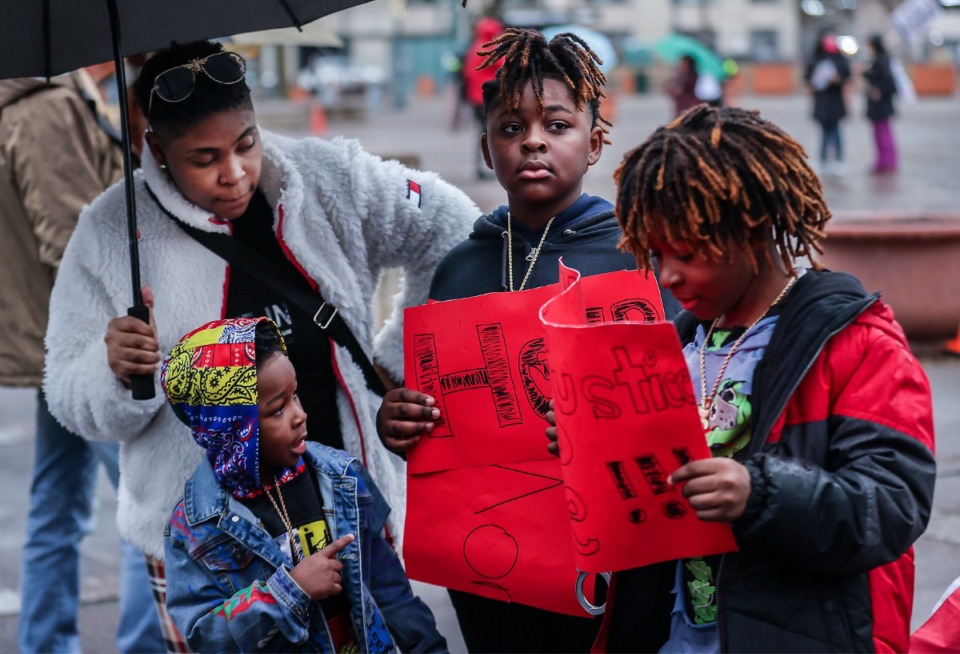 <strong>Nakia Harrison (right) along with her children Darius, Devonte, and Daniel Smith, attend a rally for Tyre Nichols in Downtown Memphis Jan. 28, 2023.</strong> (Patrick Lantrip/The Daily Memphian)