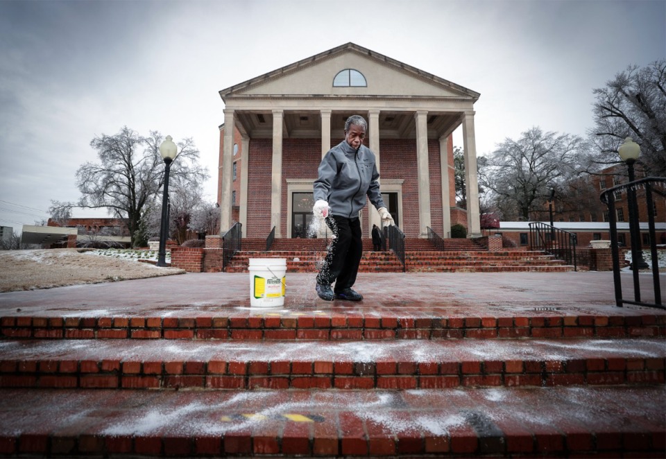<strong>Terry Lawrence puts down salt on the icy steps of Mississippi Boulevard Christian Church before the funeral of Tyre Nichols Feb. 1, 2023.</strong> (Patrick Lantrip/The Daily Memphian)