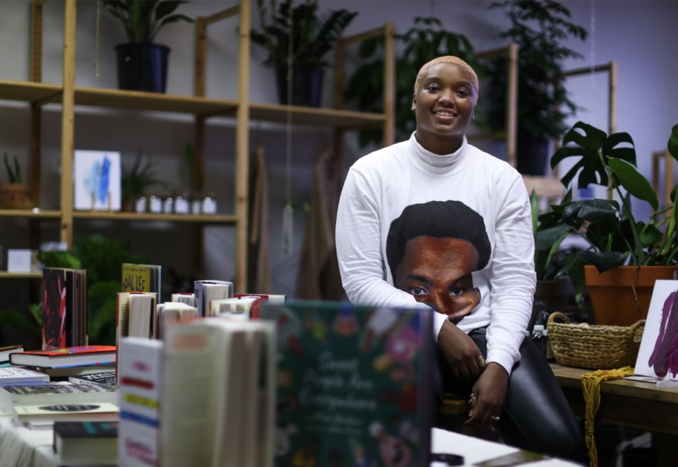 <strong>Jasmine Settles, the owner of online bookstore Cafe Noir, poses for a portrait during a pop-up sale at Terra Cotta Nursery on Summer Avenue on Feb. 26, 2022.</strong> (Patrick Lantrip/The Daily Memphian)