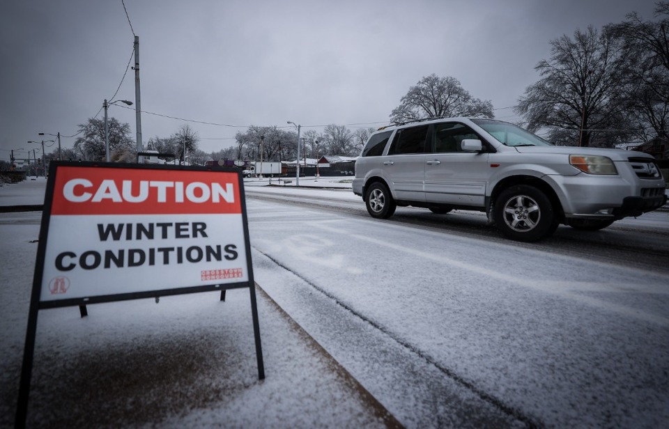 <strong>A caution sign sits at the entrance of the Crosstown Concourse in Midtown Memphis during an ice storm warning Jan. 31, 2023.</strong> (Patrick Lantrip/The Daily Memphian)