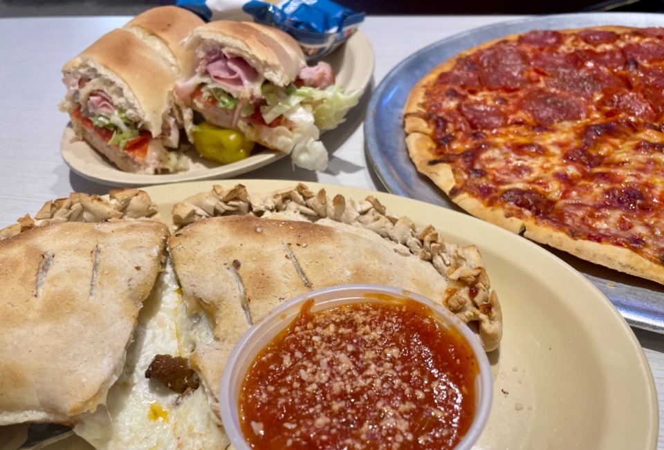 <strong>An Italian sub sandwich, a calzone and a 13-inch cheese pizza with added pepperoni&nbsp;</strong><strong>at Memphis Pizza Caf&eacute;.</strong>&nbsp;(Jennifer Biggs/The Daily Memphian)