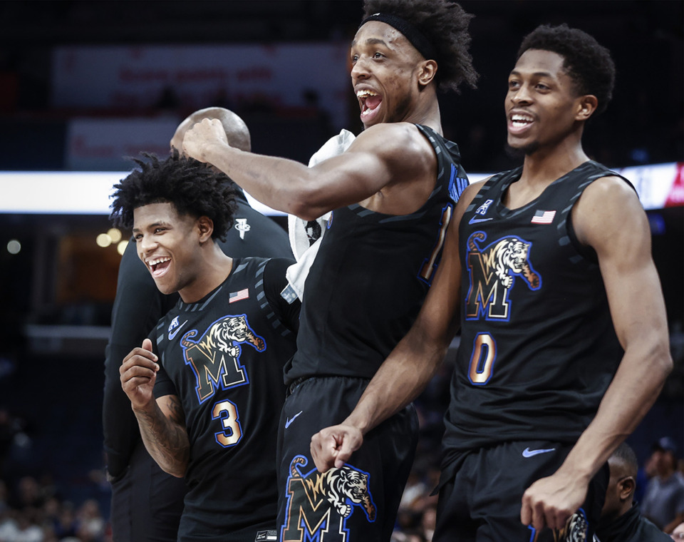 <strong>Tigers teammates (left to right) Kendric Davis, DeAndre Williams and Elijah McCadden celebrate on the bench during action against SMU on Thursday, Jan. 26.</strong> (Mark Weber/The Daily Memphian)