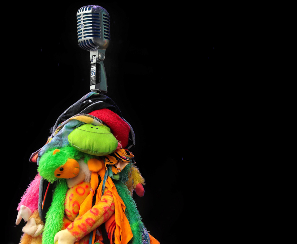 <strong>A microphone prop adds some color to the stage during Muck Sticky's performance at the 2019 Beale Street Music Festival on May 4, 2019, at Tom Lee Park. Despite a persistent drizzle, thousands of fans turned out for performances by Muck Sticky, Echosmith, OneRepublic and Blind Mississippi Morris as well as a surprise visit by Miley Cyrus.</strong> (Jim Weber/Daily Memphian)