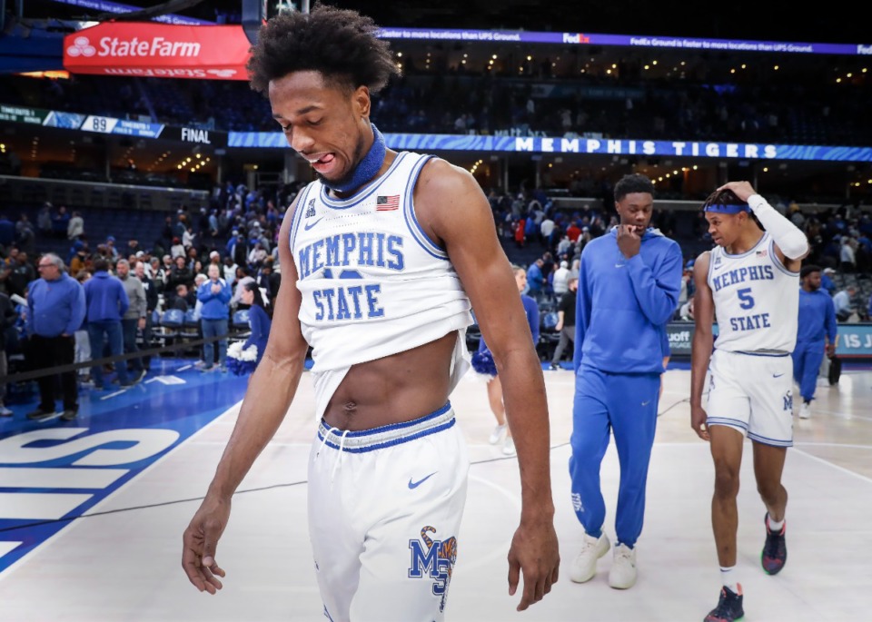 <strong>Dejected Tigers forward DeAndre Williams (left) walks off the court after losing Tulane on Saturday, Feb. 4, 2023.</strong> (Mark Weber/The Daily Memphian)