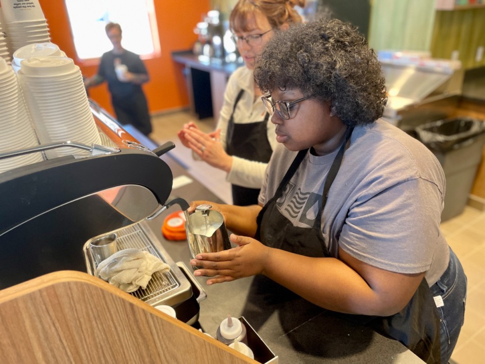 <strong>Barista Taylor Ellis prepares the froth for a cappuccino with instruction from Biggby trainer Katie Bacon. Biggby Coffee opens Tuesday at 200 S. Germantown Parkway.</strong> (Jennifer Biggs/Daily Memphian)