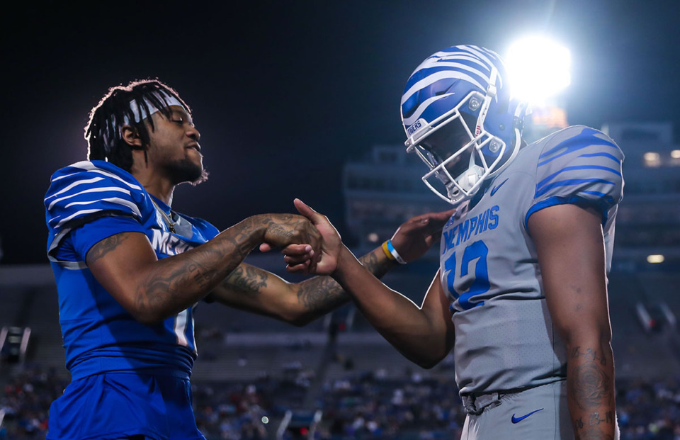 <strong>University of Memphis wide receiver Joseph Scates (11) congratulates quarterback Tevin Carter (12) after a long touchdown pass at the Tiger's game on April 22, 2022.</strong> (Patrick Lantrip/The Daily Memphian file)