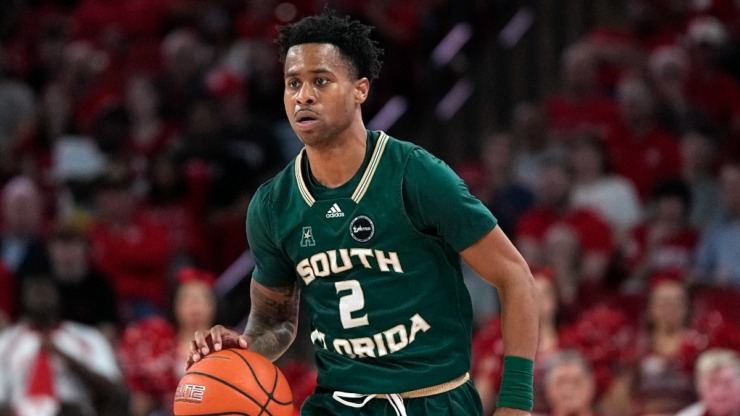 South Florida's Tyler Harris (2) brings the ball up the court against Houston during the second half of an NCAA college basketball game Wednesday, Jan. 11, 2023, in Houston. Houston won 83-77. (AP Photo/David J. Phillip)