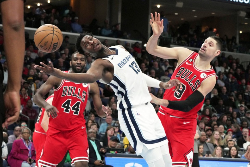 <strong>Memphis Grizzlies forward Jaren Jackson Jr. reaches for the ball as Chicago Bulls' Nikola Vucevic (9) defends on Feb. 7, 2023. JJJ had a great night and the Grizzlies won, but the team has been facing some adversity.</strong> (Karen Pulfer Focht/AP)