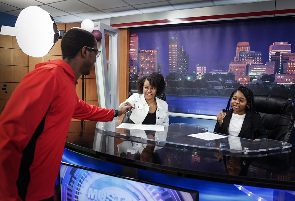 <strong>Memphis T-STEM East High School actors Brianna Campbell (left) and Nakyah Sykes (right) are congratulated after presenting a newscast during a grand opening ceremony for the school&rsquo;s new TV studio on Feb. 7.</strong> (Mark Weber/The Daily Memphian)
