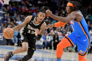 <strong>Memphis Grizzlies guard Ja Morant (12) drives against Oklahoma City Thunder forward Luguentz Dort (5) during the first half of an NBA basketball game Friday, Nov. 18, 2022, in Memphis, Tenn.</strong> (AP File Photo/Brandon Dill)