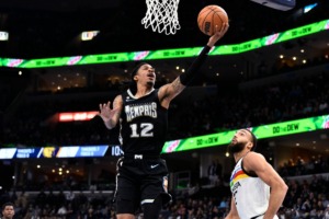 <strong>Memphis Grizzlies guard Ja Morant (12) shoots over Minnesota Timberwolves center Rudy Gobert on Friday, Feb. 10, 2023.</strong> (Brandon Dill/AP)